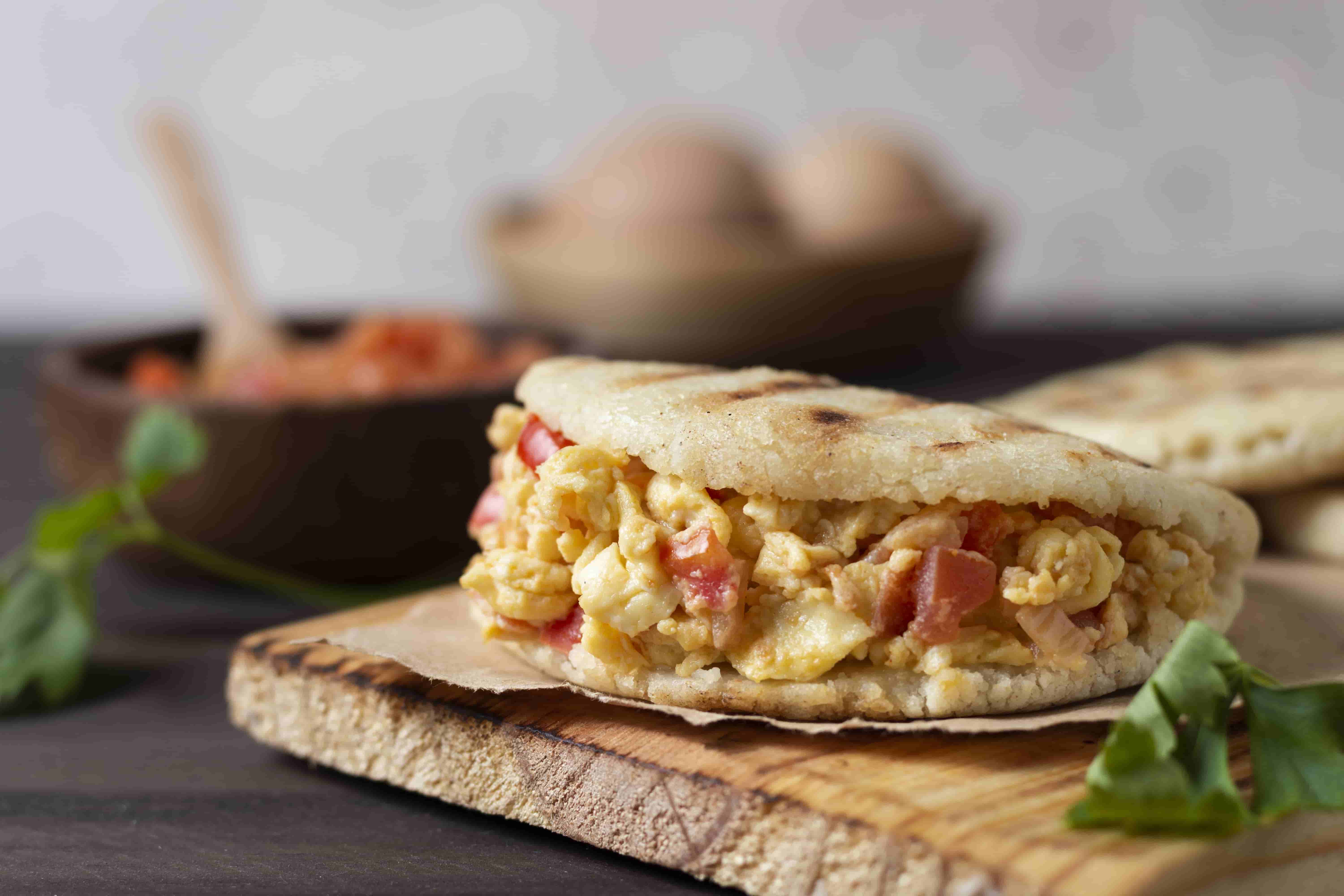 Traditional Colombian breakfast, arepa with scrambled eggs called "huevos pericos"