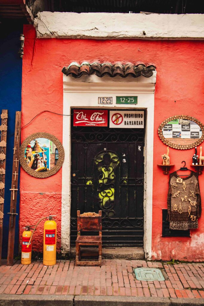 Entrance of a local shop near the Chorro de Quevedo in La Candelaria, Bogota, with traditional decorations on the walls