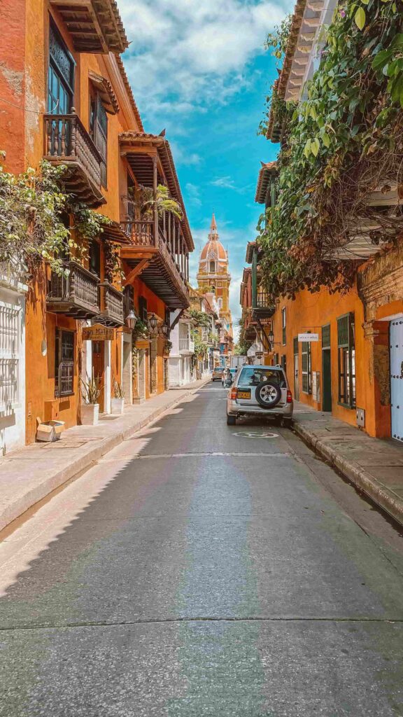 cartagena-walled-city-cathedral-view-colombia Cartagena, Colombia, street view in the walled city with balconies and the cathedral.
