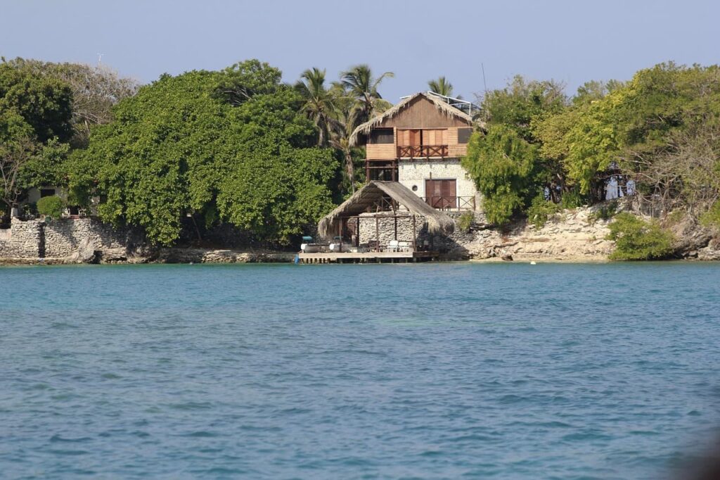 Typical house on Islas Rosario, Cartagena surrounded by the sea and vegetation.