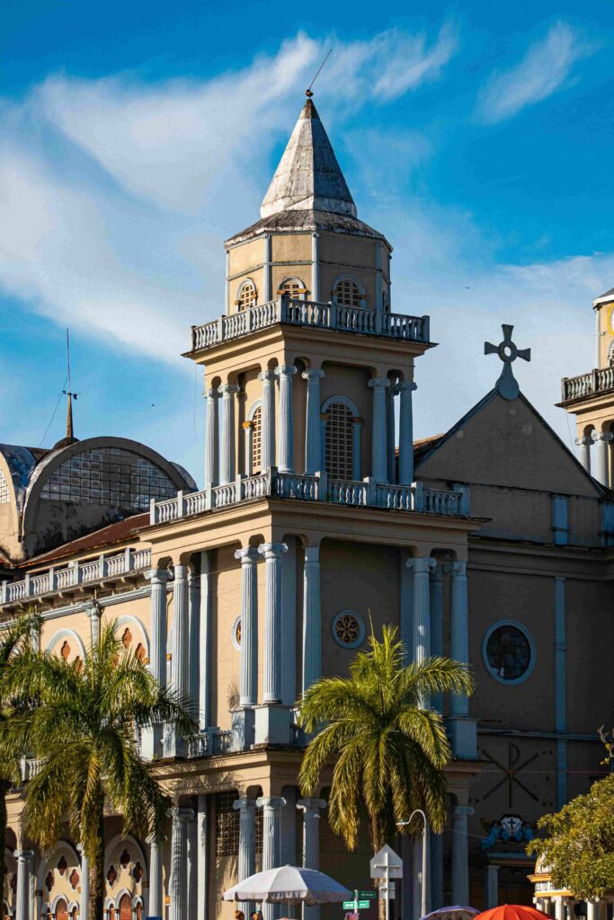 quibdo-colombia-cathedral-colorful-church-palms Colorful cathedral in Quibdo, Colombian pacific, surrounded by palm trees in the city center.